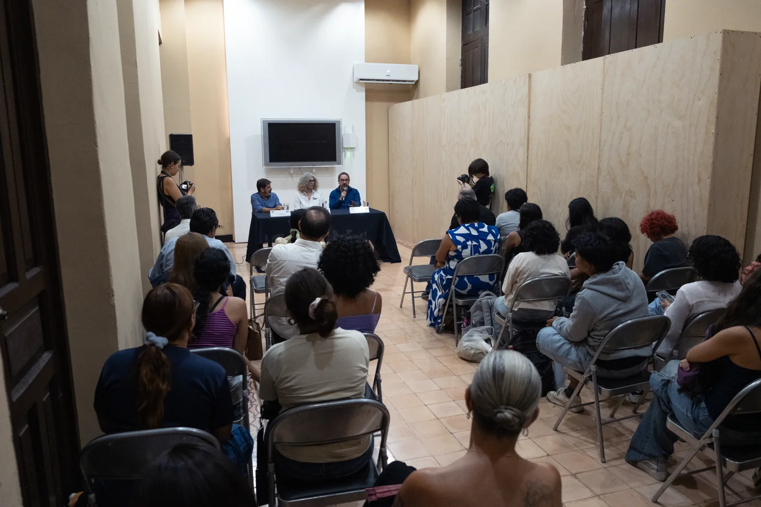 Students, professors, and art specialists attend the MoCAA lecture
