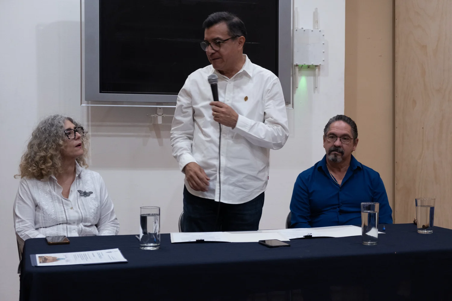 MoCAA and UADY representatives seated at the signing table
