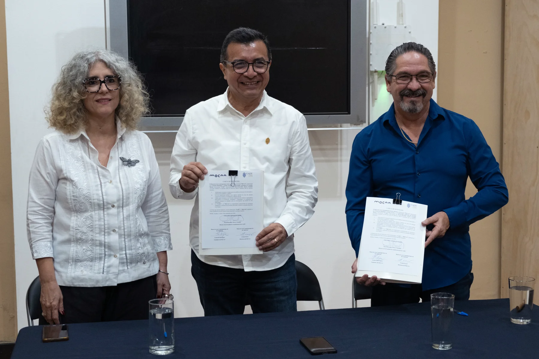 MoCAA directors Leonardo Rodriguez and Ivonne Ferrer with UADY representative David Reynaldo Alcocer displaying the signed letter of intent