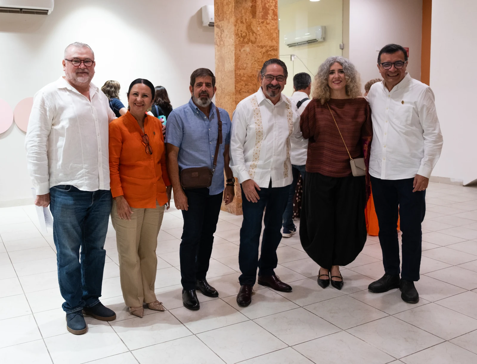 Ivonne Ferrer and exhibition organizers at the opening in Mérida