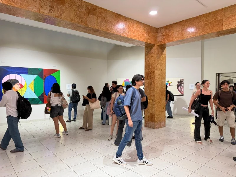 Visitors explore Ivonne Ferrer’s exhibition at UADY
