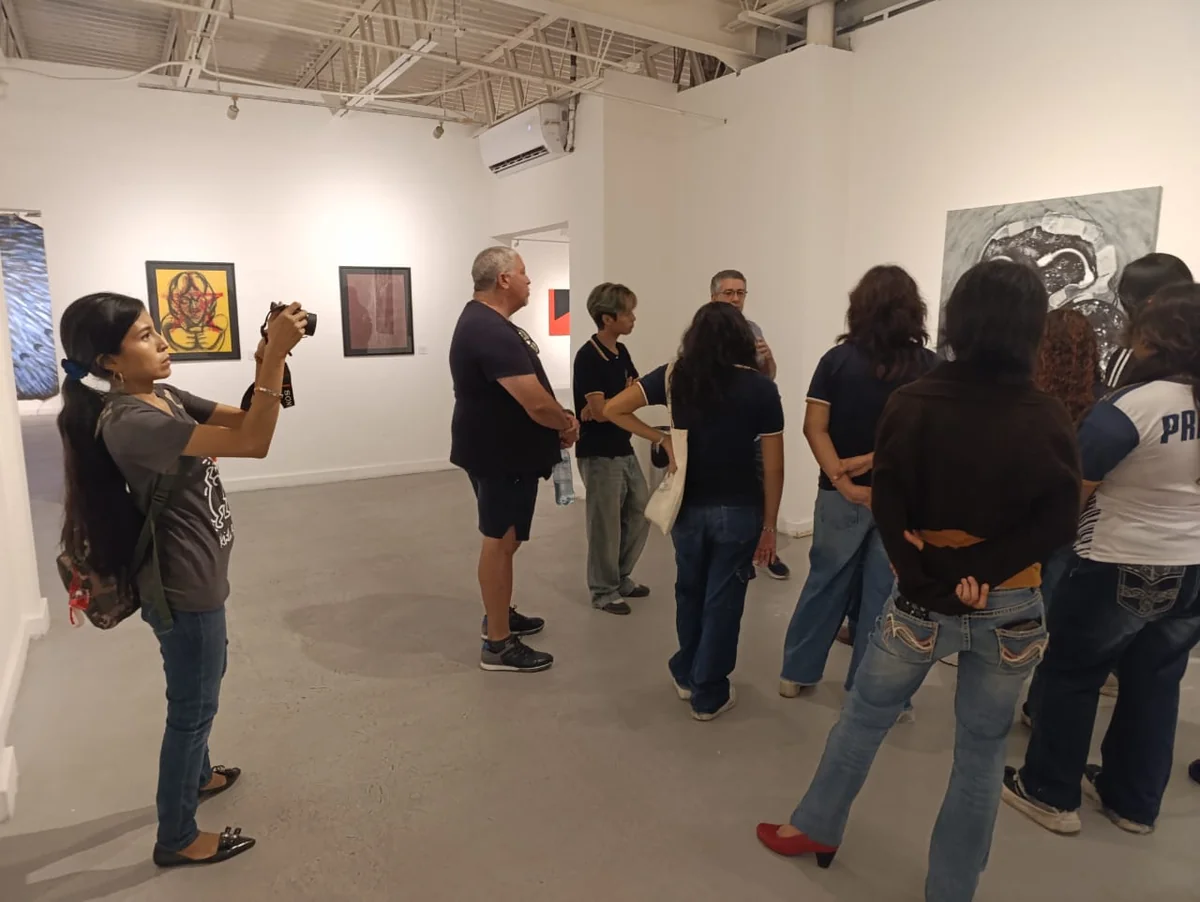 Visitors observing the exhibition rooms during the guided tour at the Museo de la Ciudad de Mérida.