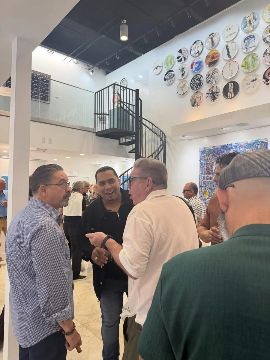 Guests in conversation during the opening of Beauty as Protest at MoCAA.