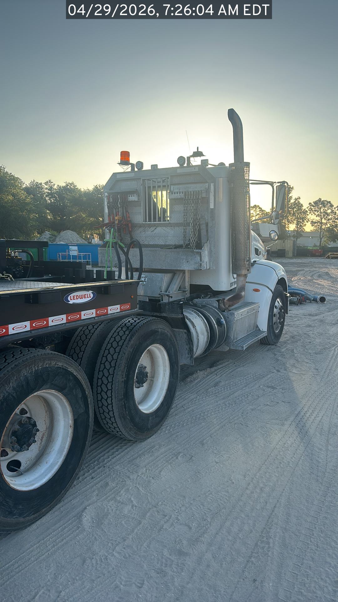 Photo of the Peterbilt 384 listed for sale, view from the rear passenger side of the vehicle looking towards the cab
