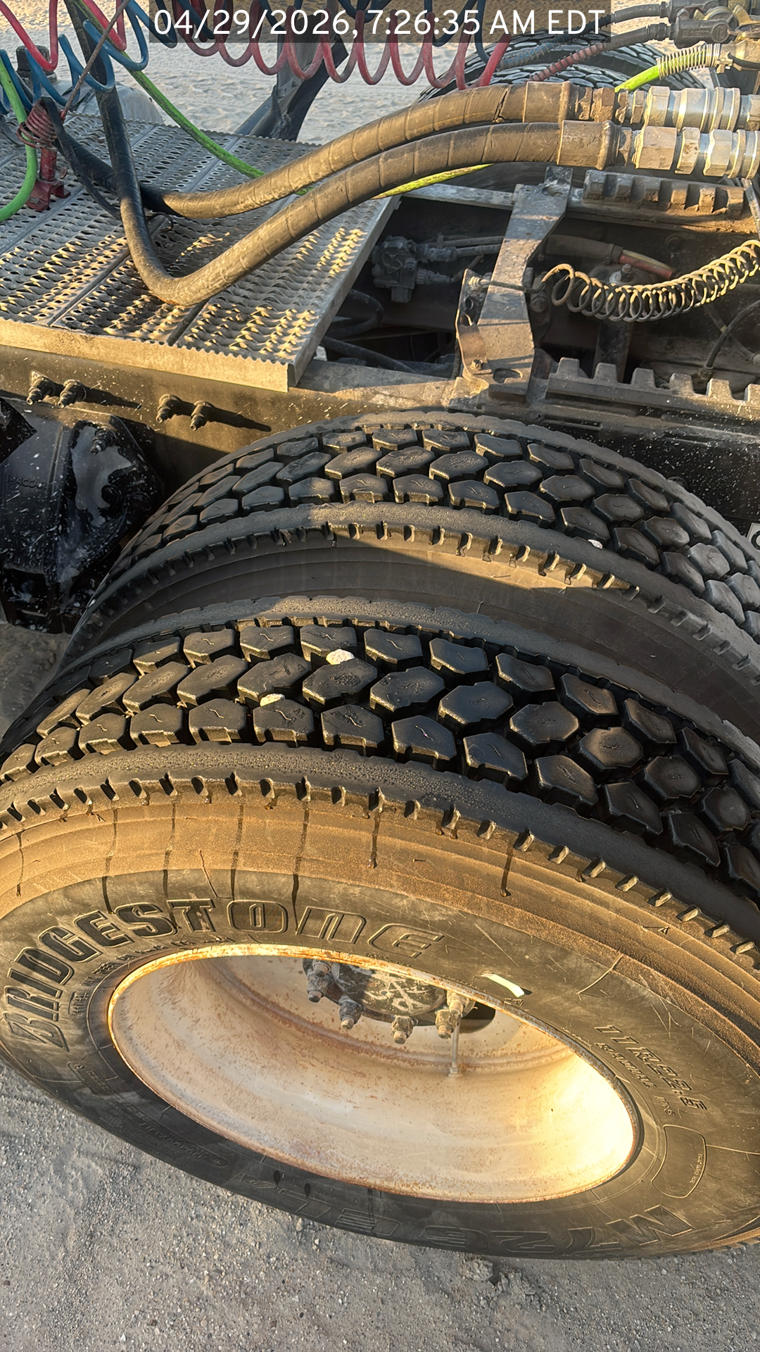 Closeup on the tires of the Peterbilt 384 listed for sale, showing tread