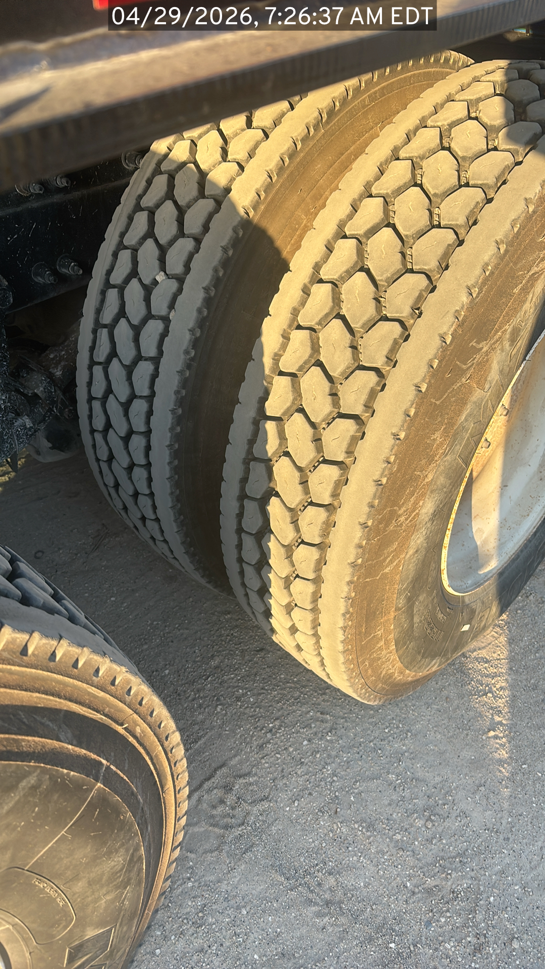 Closeup on the tires of the Peterbilt 384 listed for sale, showing tread