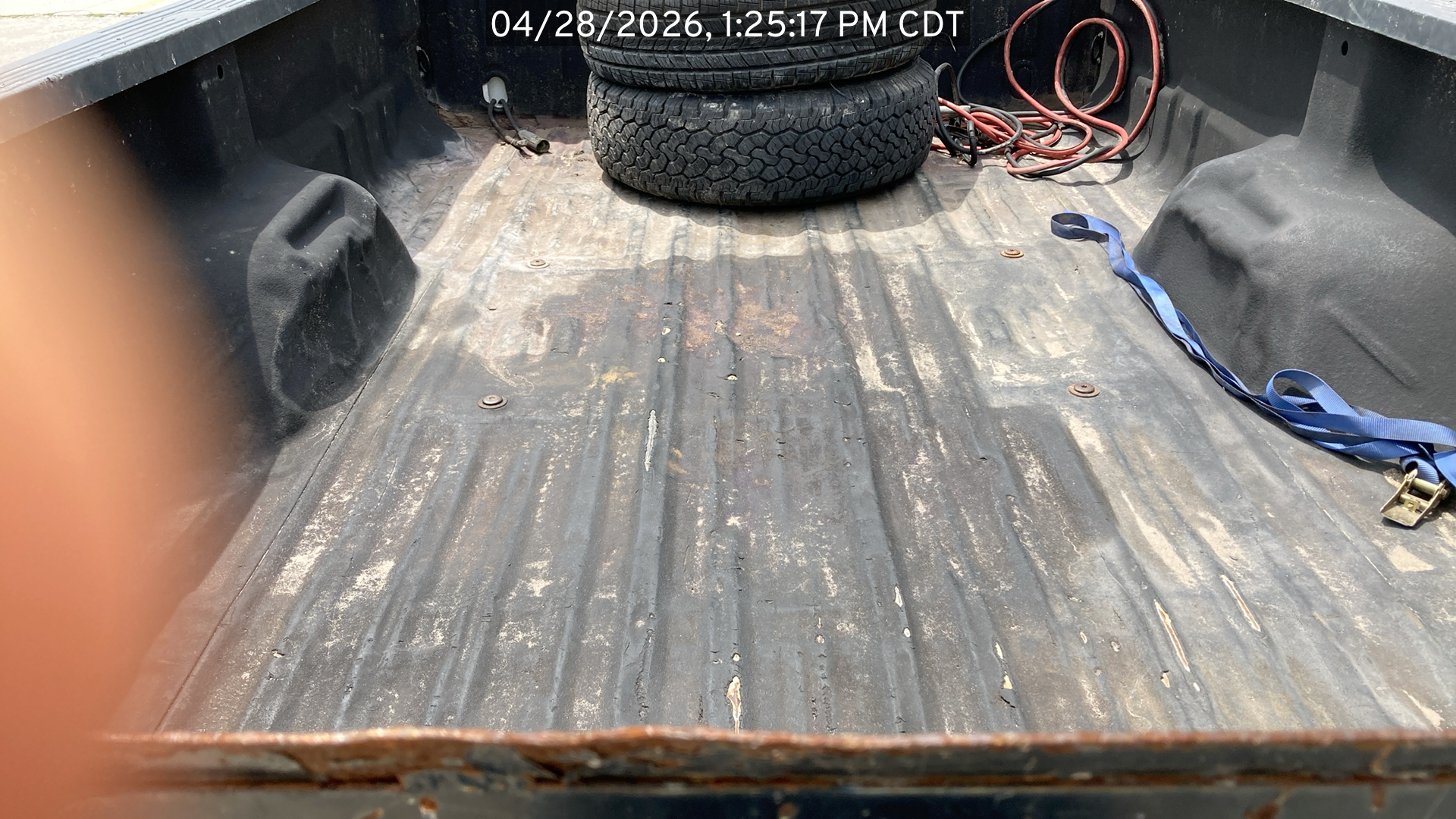 Image of the Ford F250 listed for sale, focus on the truck bed