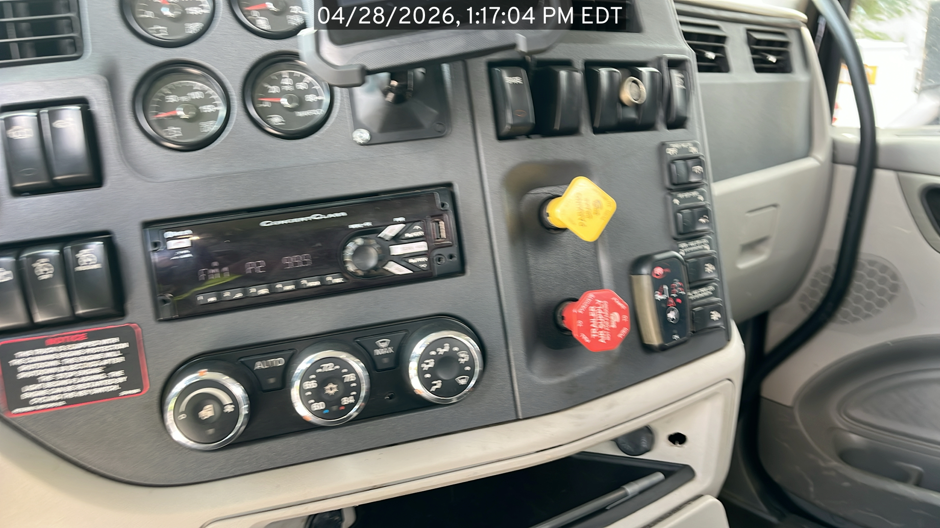Photo of the Peterbilt 567 listed for sale, view of dashboard controls