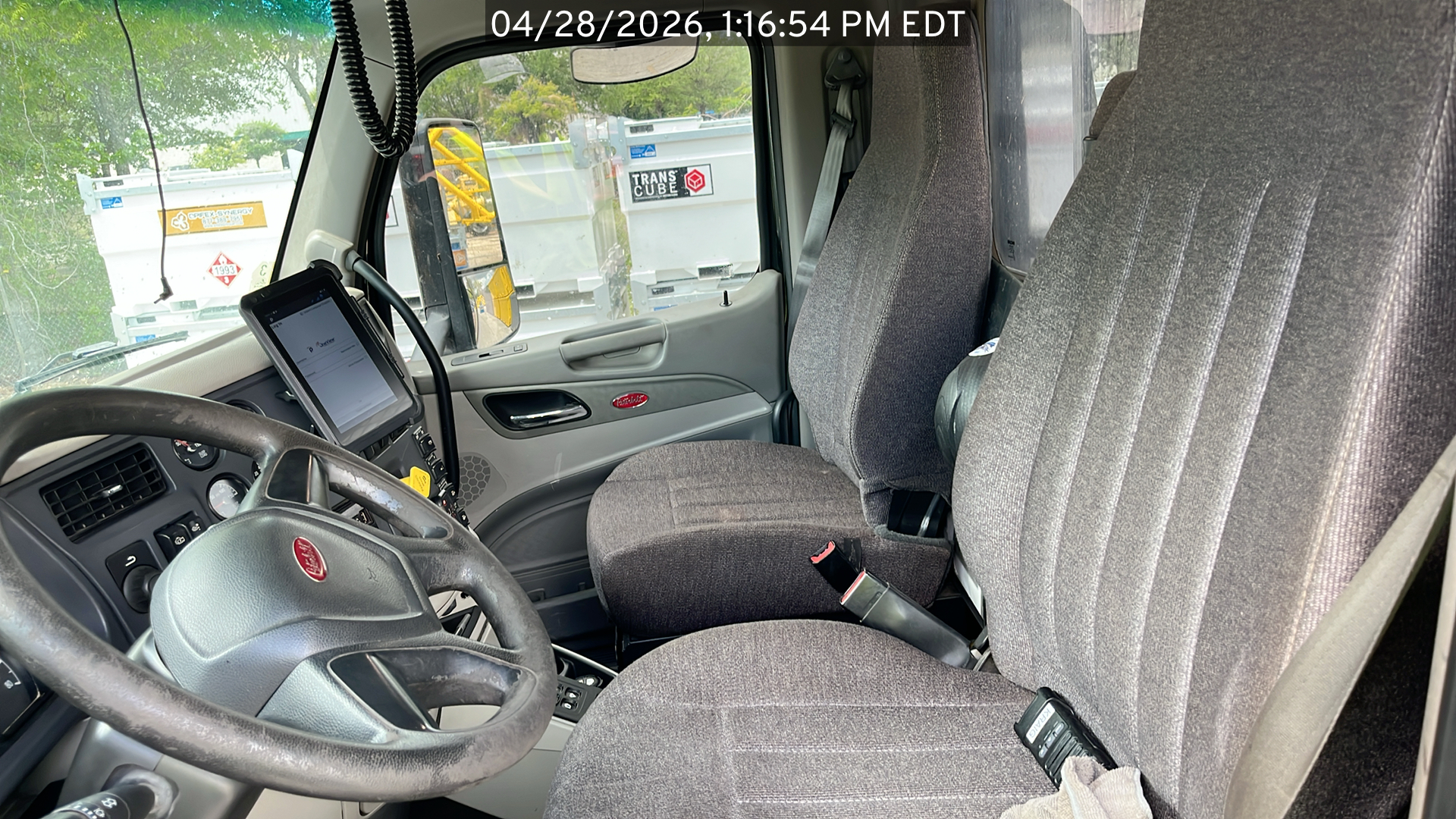 Photo of the Peterbilt 567 listed for sale, view from front passenger side of the vehicle, view inside the cab
