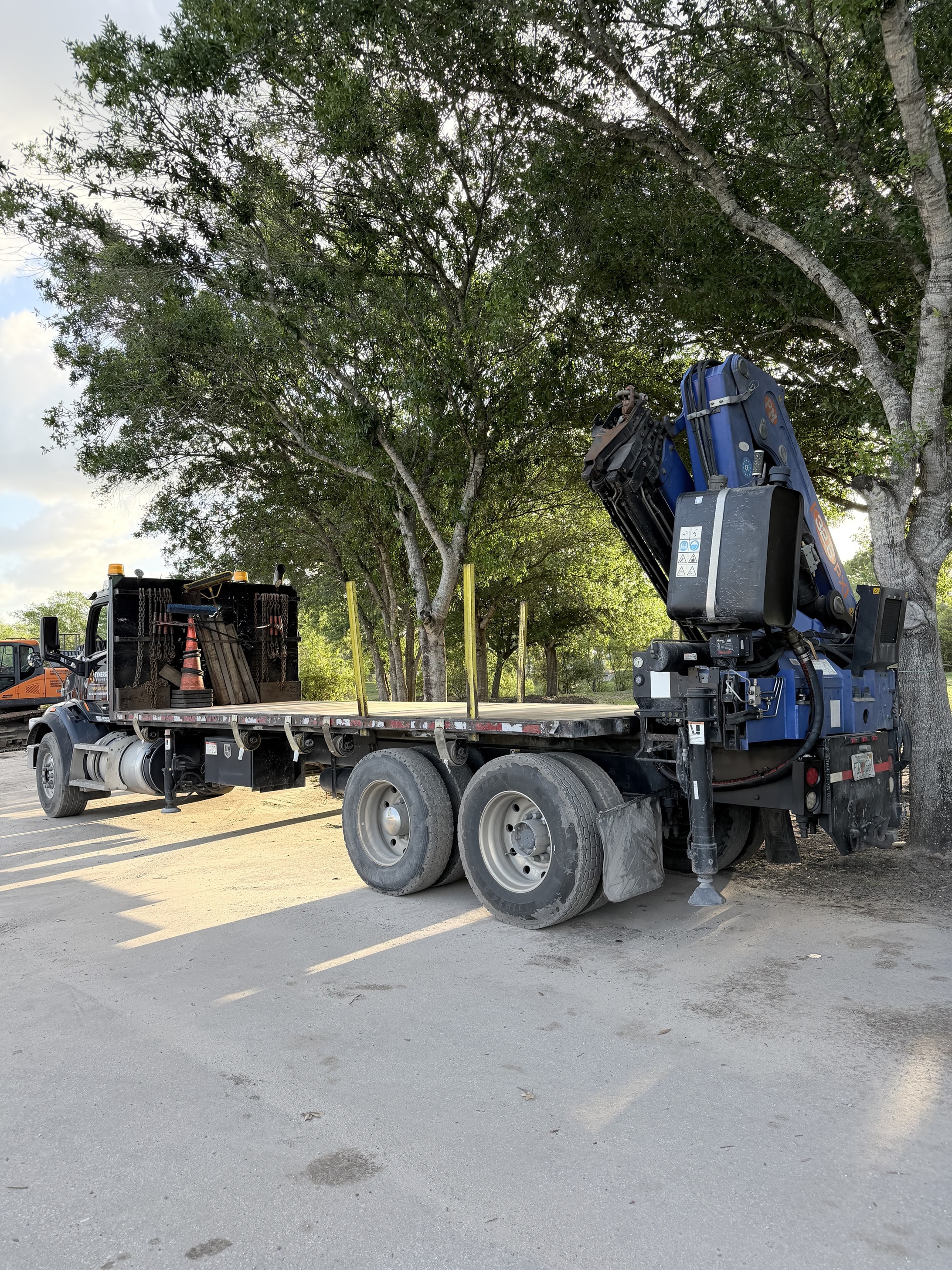 Photo of the Peterbilt 567 listed for sale, view from the back driver's side of the vehicle