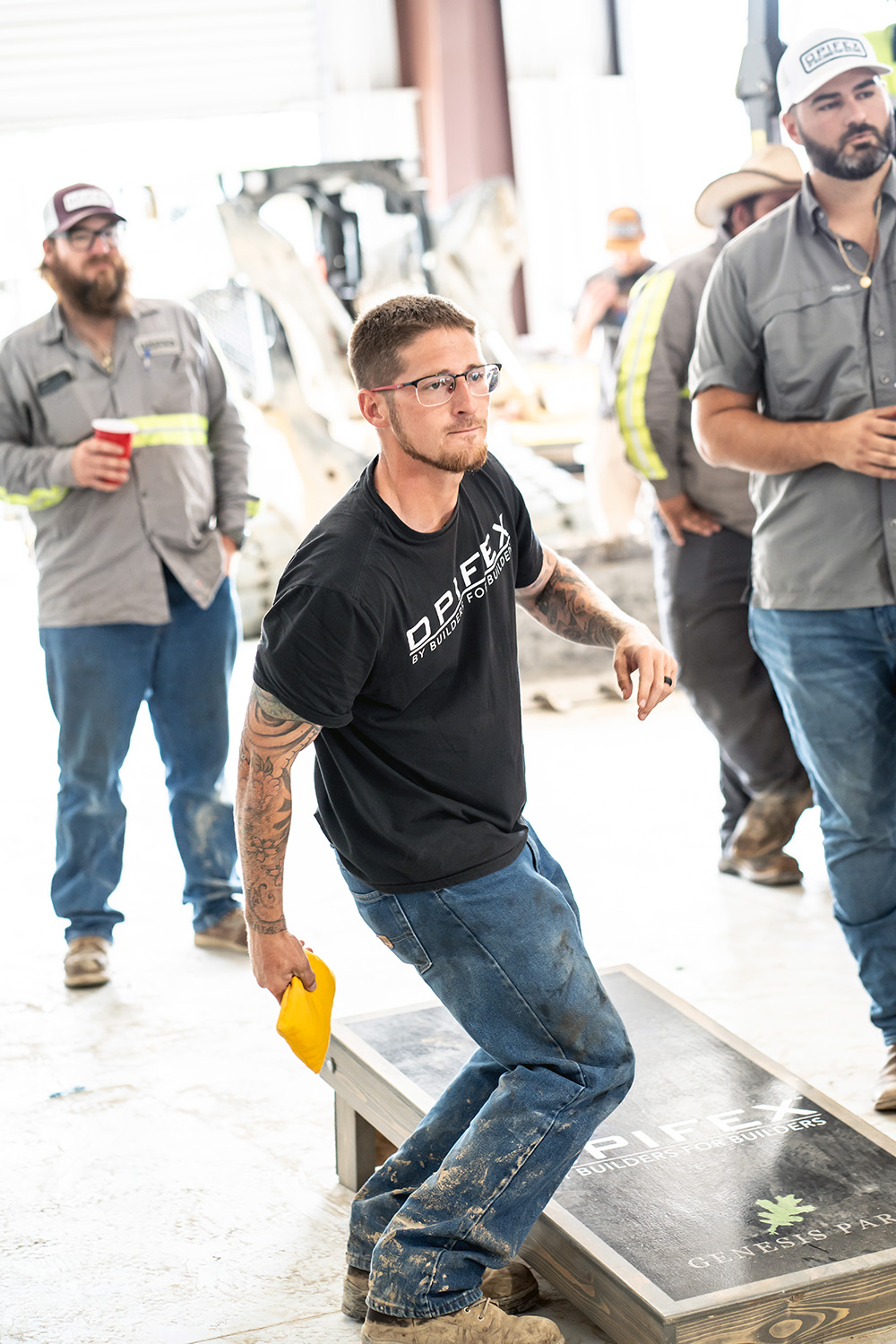 Our crew playing cornhole at the shop