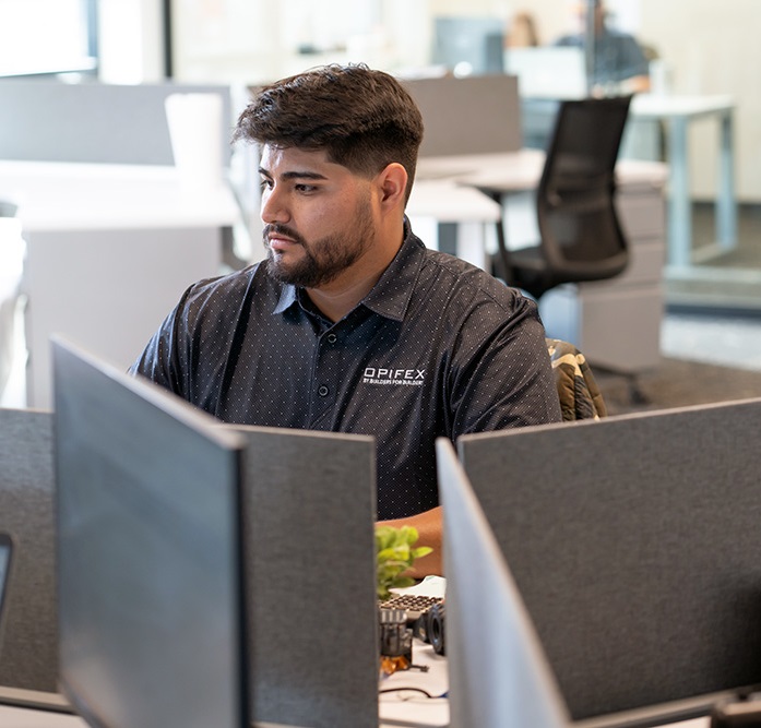 An office worker is sitting at his computer