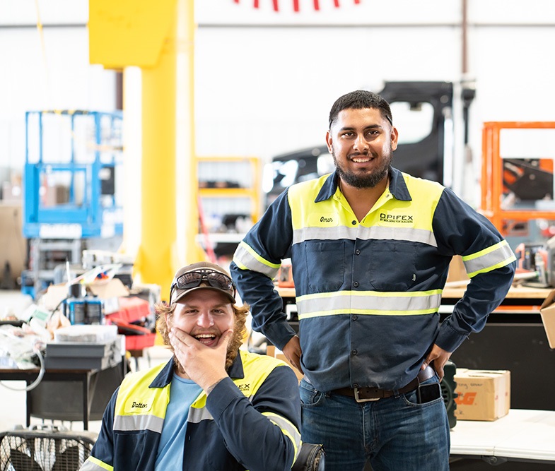 Two happy employees at our shop