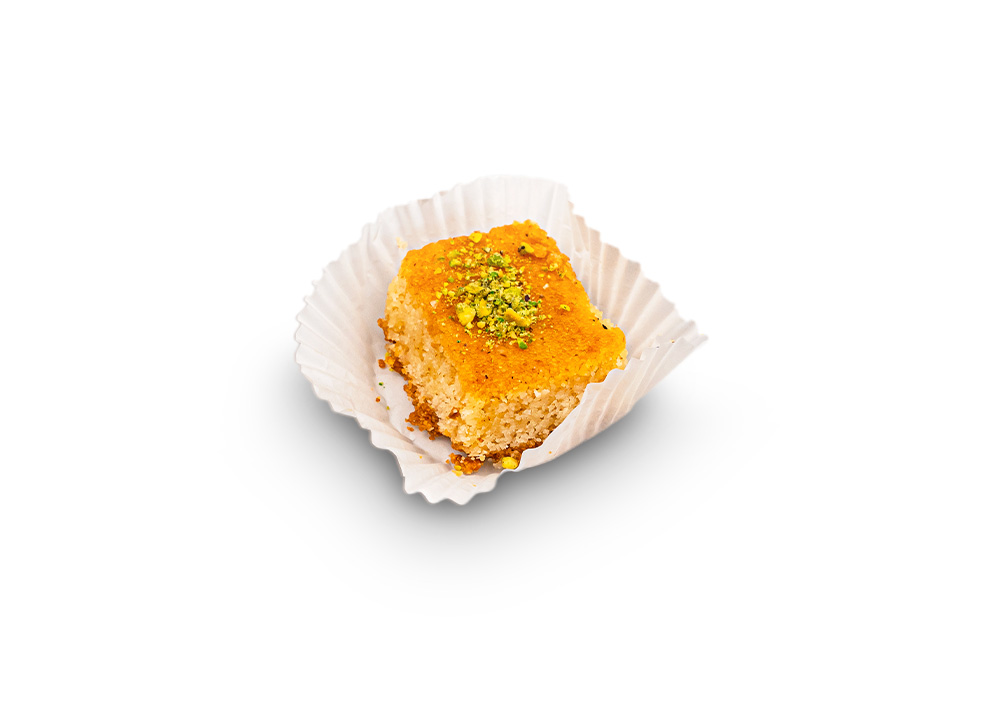 Semolina cake squares topped with almonds and syrup