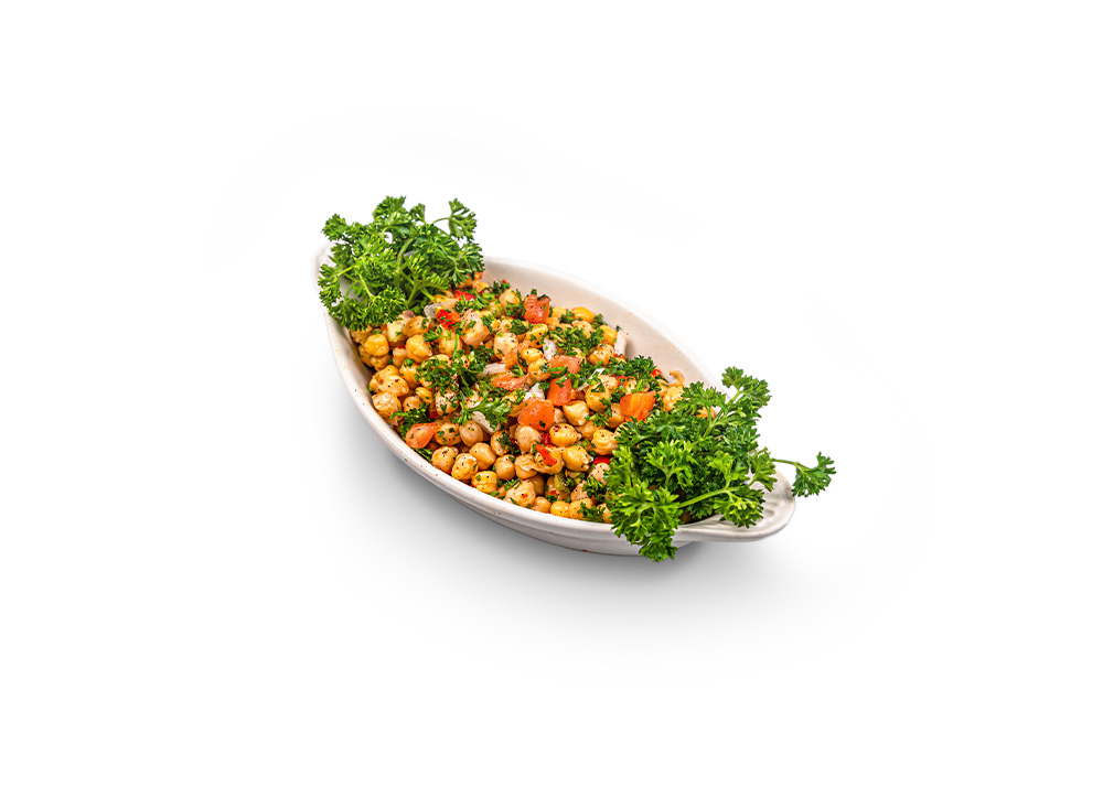 Whole chickpeas mixed with chopped vegetables and herbs
