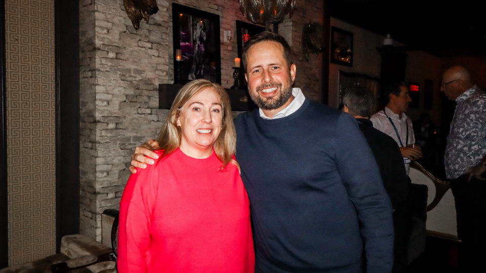 Mark White on the right with an attendee at the ServiceNow SKO: After Dark event hosted by Zaelab