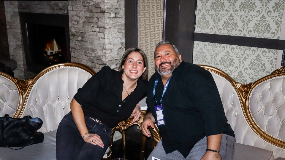 Two attendees at the ServiceNow SKO: After Dark event hosted by Zaelab