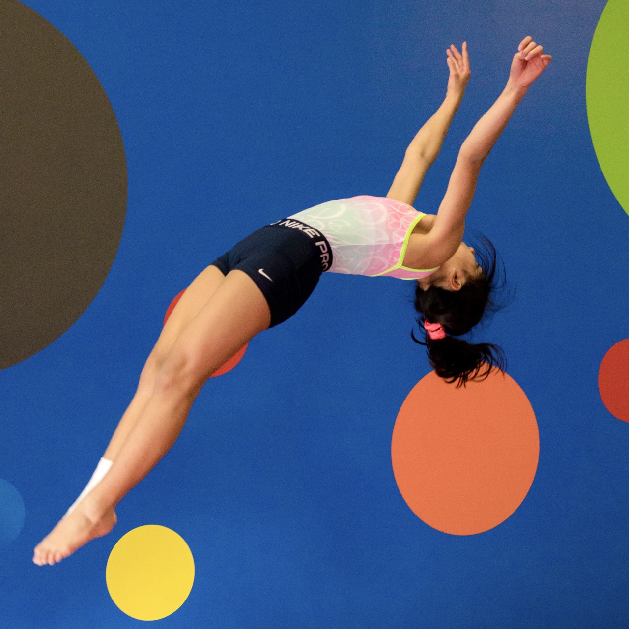 A young gymnast practicing their vault