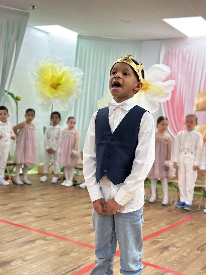 Preschool child dressed in costume preparing to perform at Children’s Land Broadway show.x