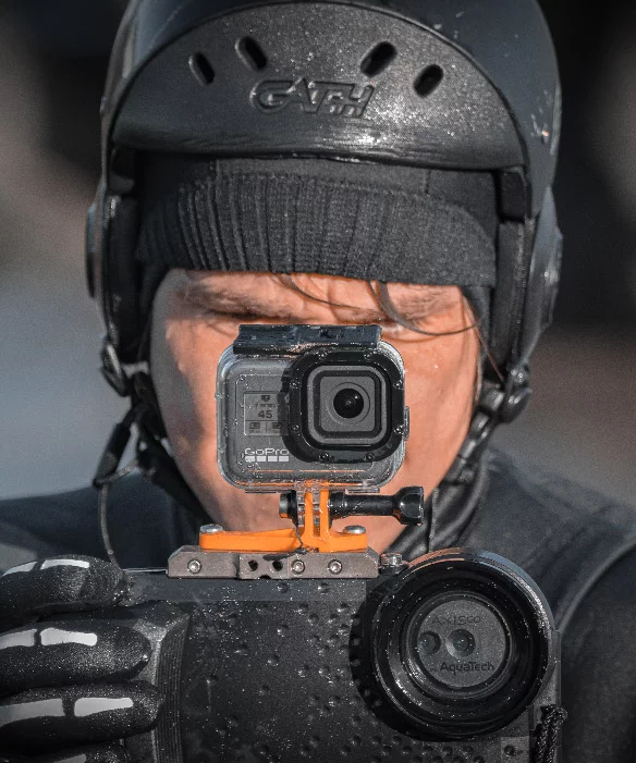 Photograph of a surfer with a camera