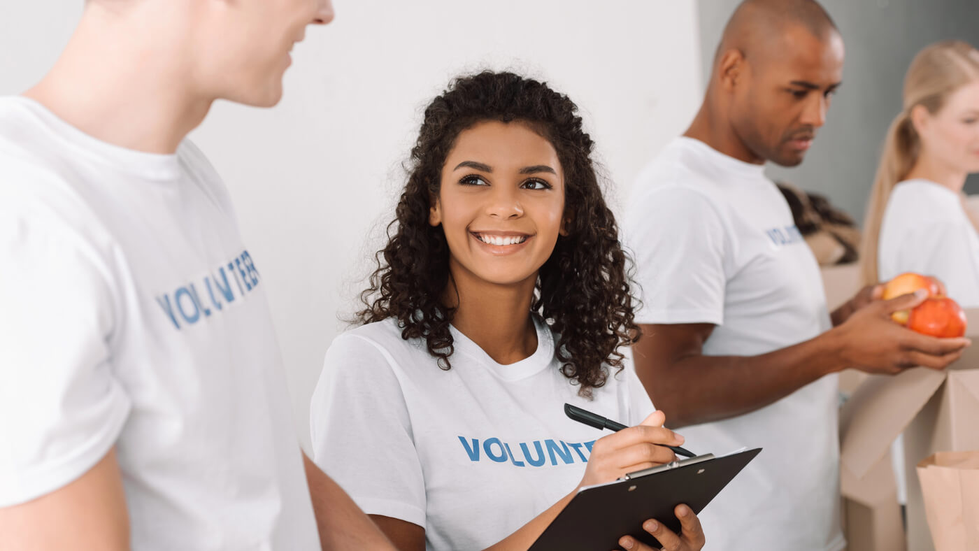 A man uses a walkie-talkie to communicate at volunteer event