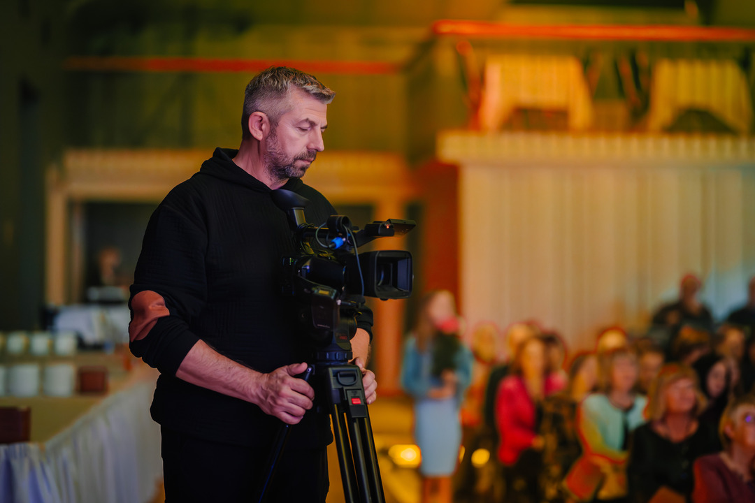 A man uses a walkie-talkie to communicate at volunteer event