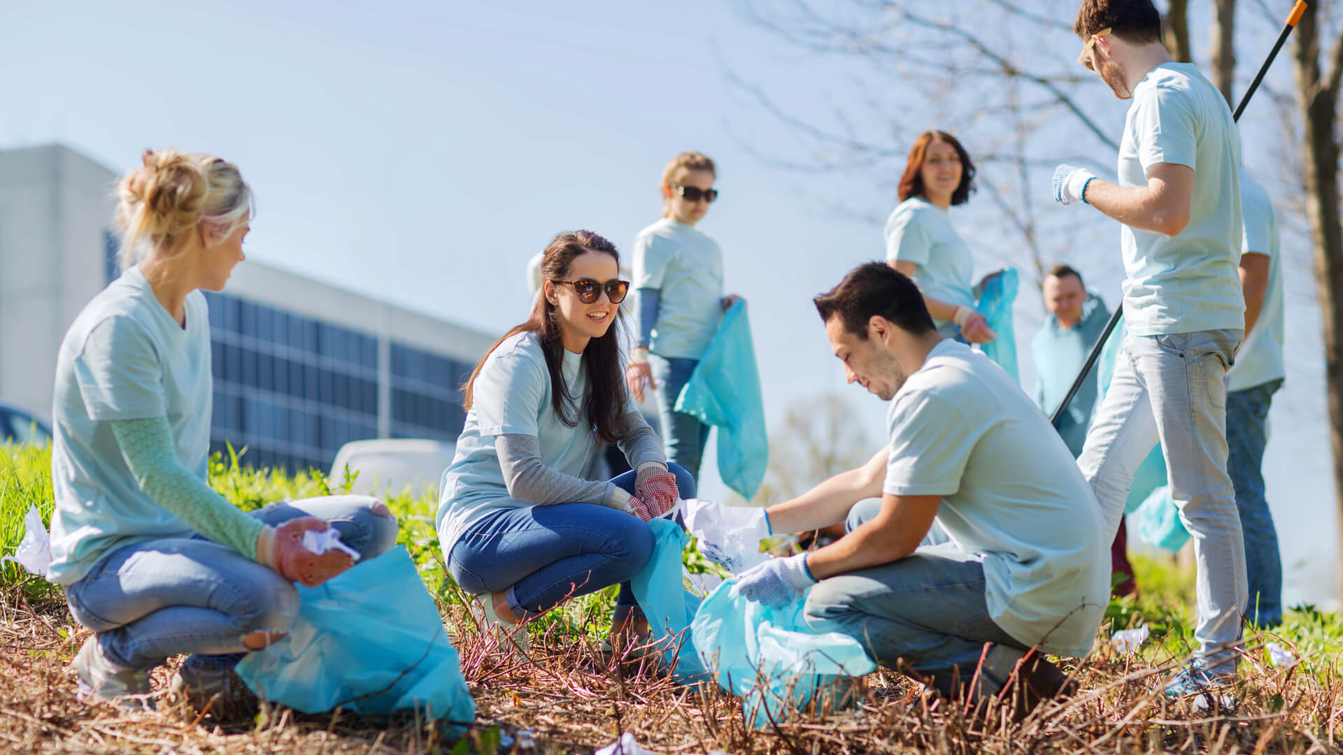 A man uses a walkie-talkie to communicate at volunteer event