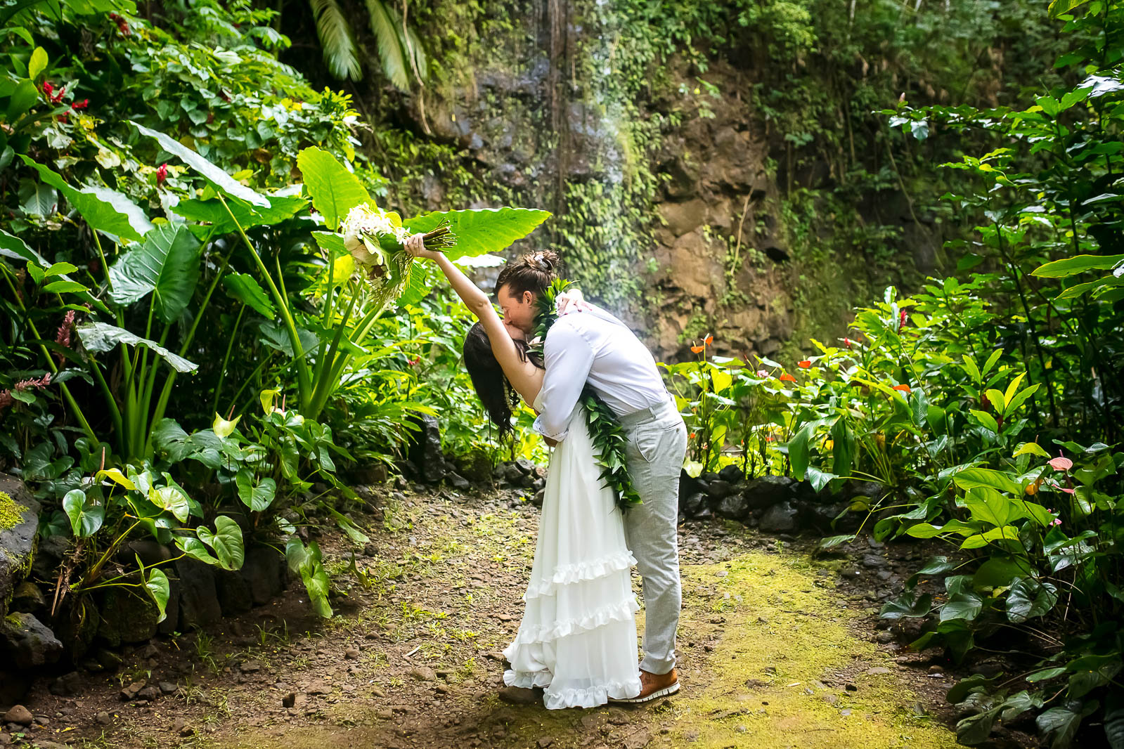 The couple share first kiss after their Kauai elopement ceremony