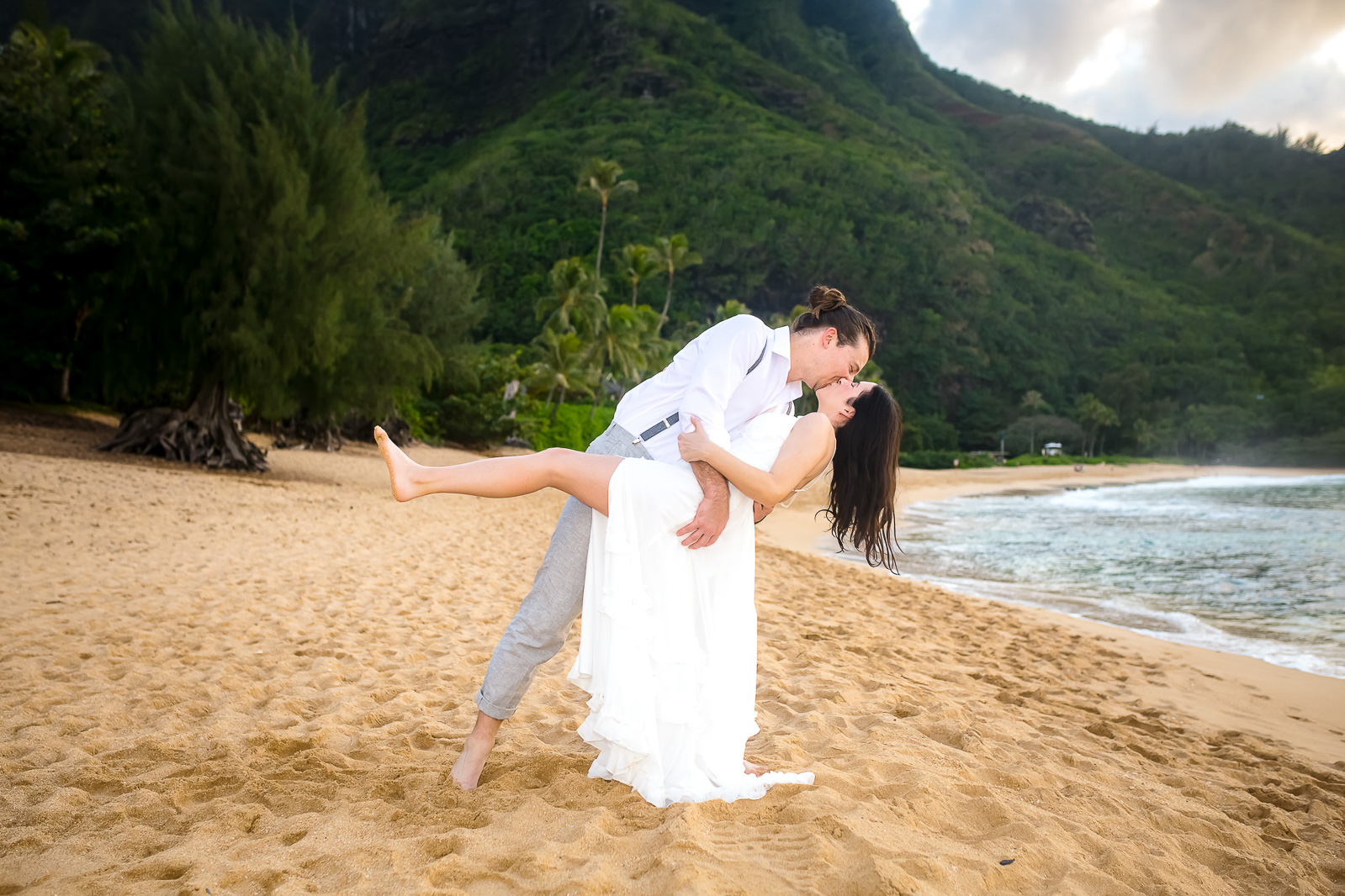 Groom dips the bride and give her a kiss in this joy filled capture