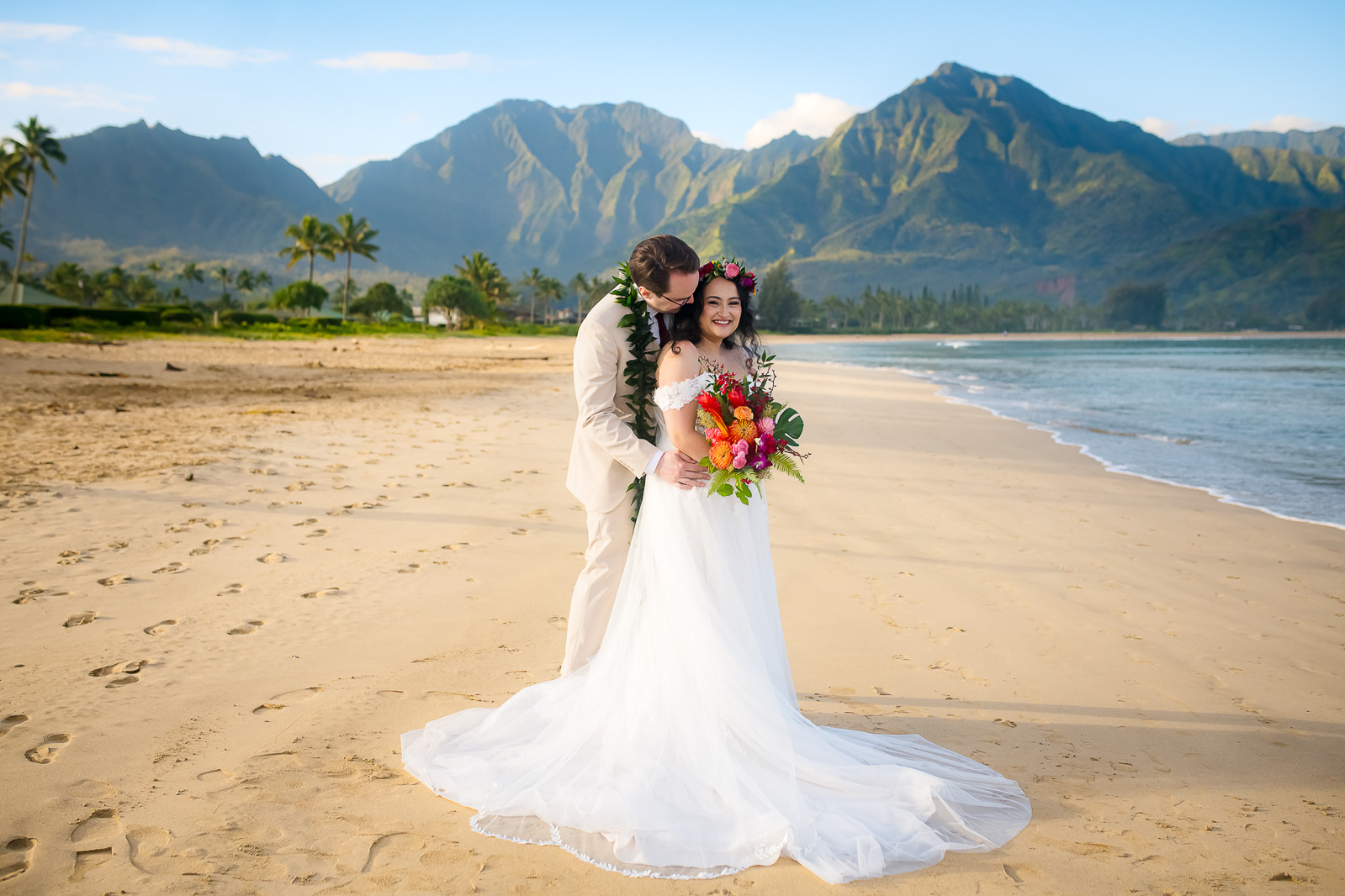 Couple embrace during their Kauai wedding photo session