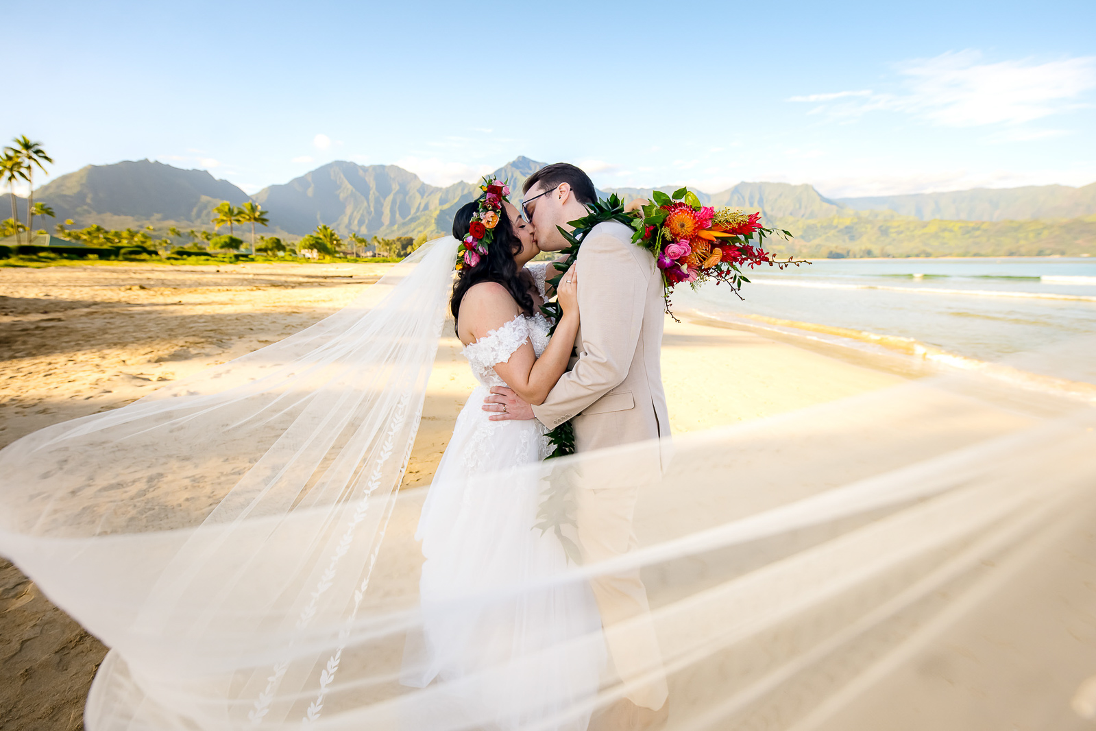 Wedding veil catching the breeze to create a stunning Kauai elopement photo