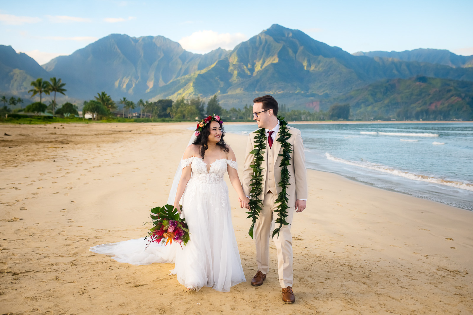 Newlywed couple share a tender moment during their Kauai elopement photoshoot