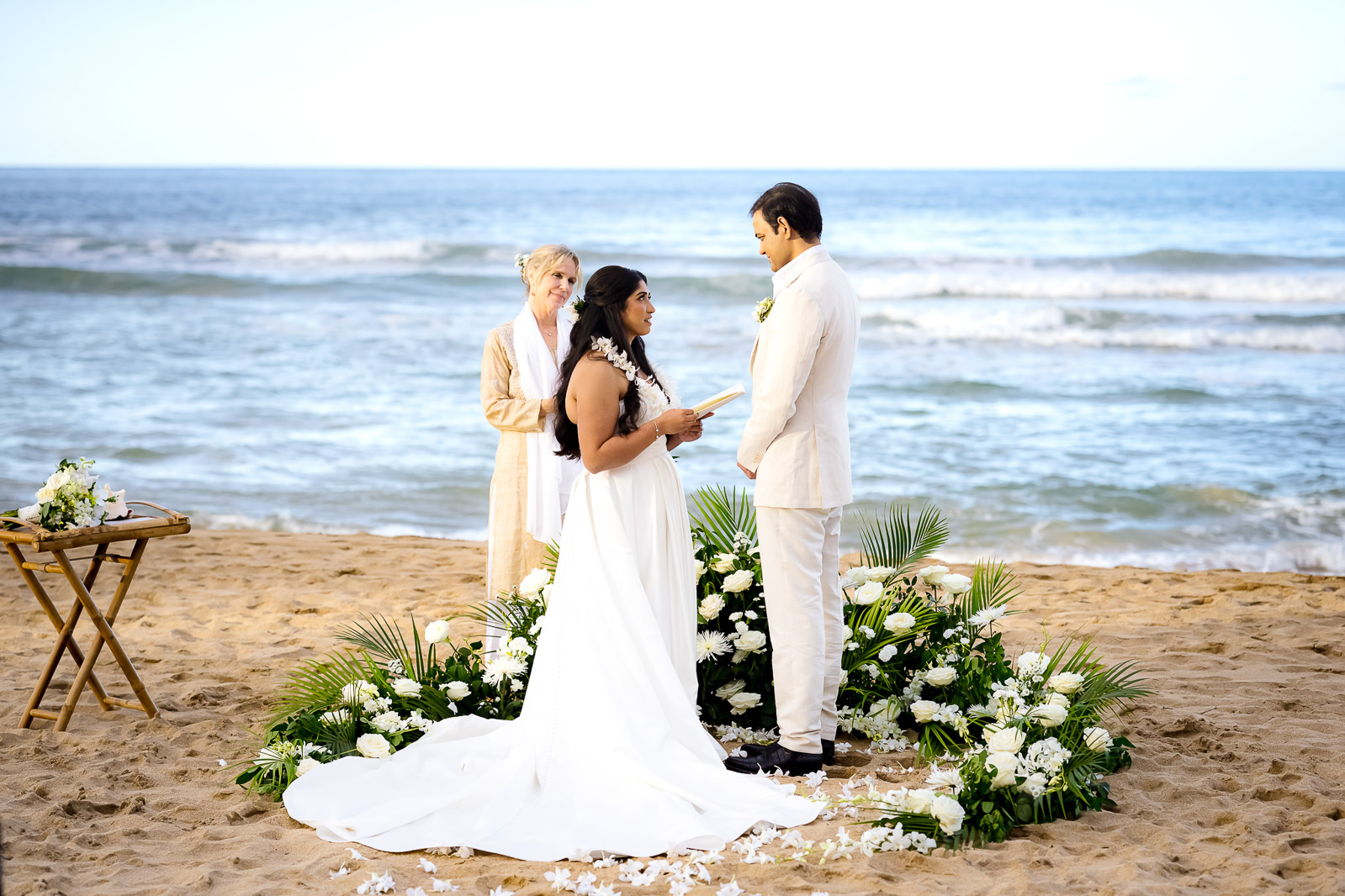 wedding officiant and bride and groom on kauai beach wedding