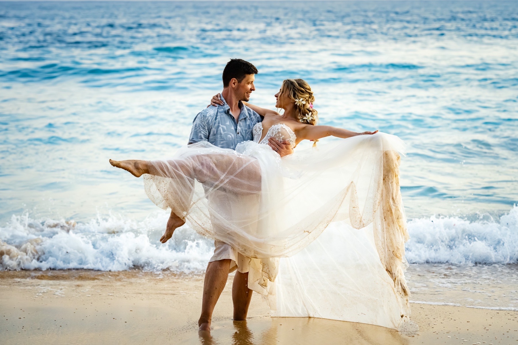 kauai elopement wedding bride in grooms arms