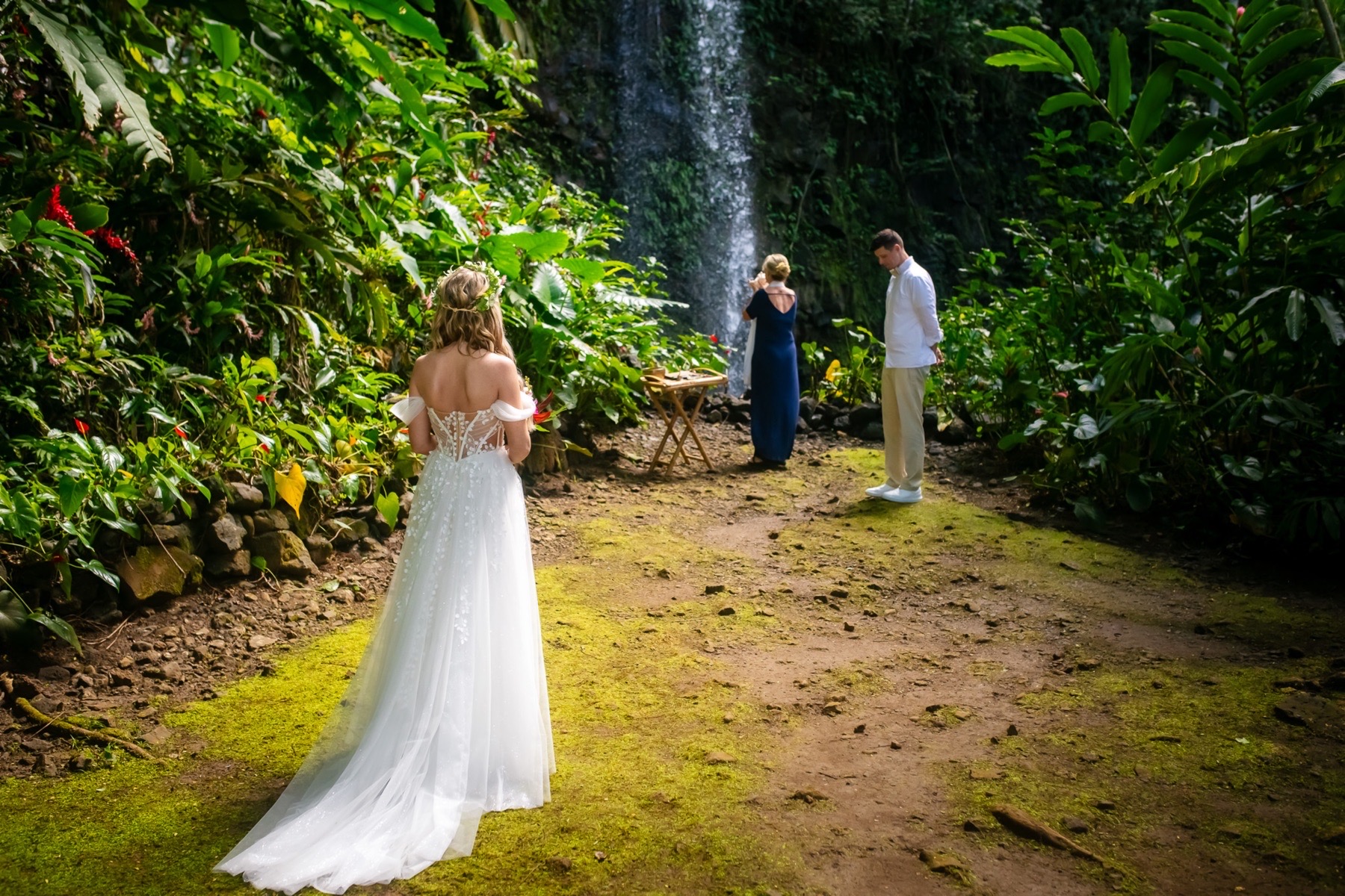 kauai waterfall wedding bride walking up to groom