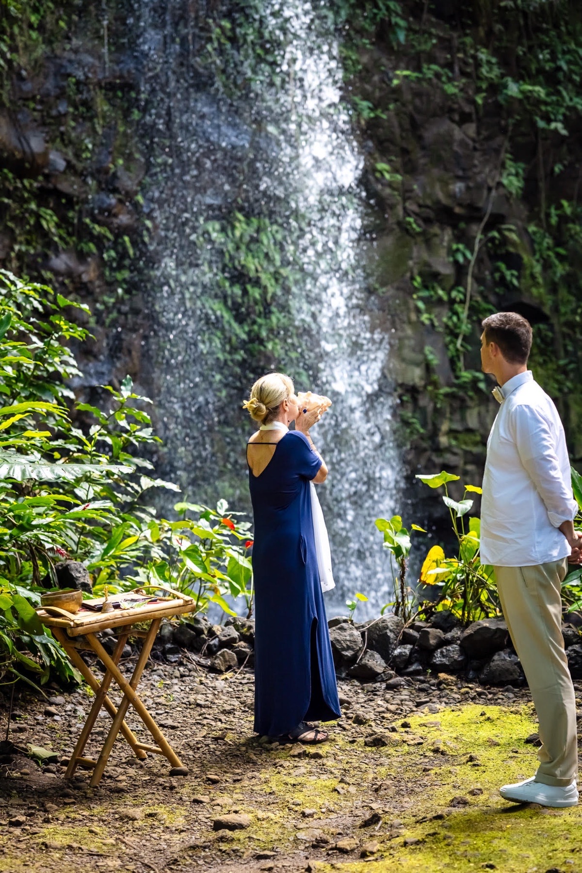 shell blowing waterfall wedding kauai