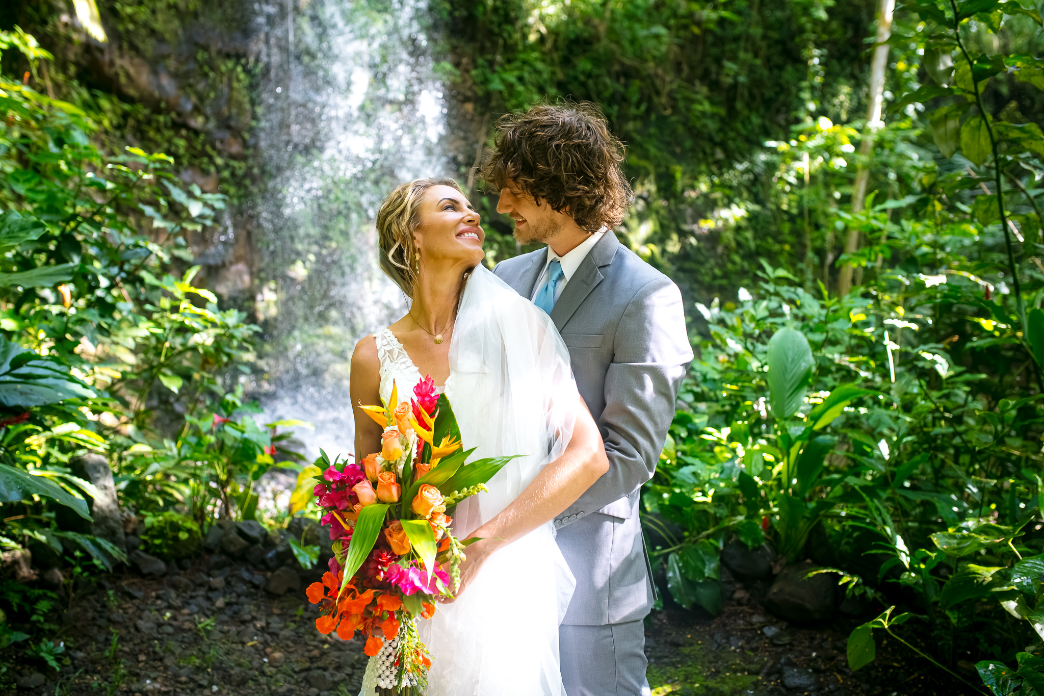 kauai waterfall portrait of bride and groom