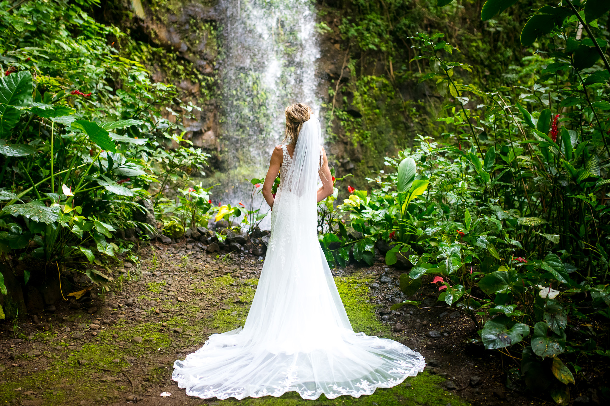 bridal portrait on kauai in front of waterfall