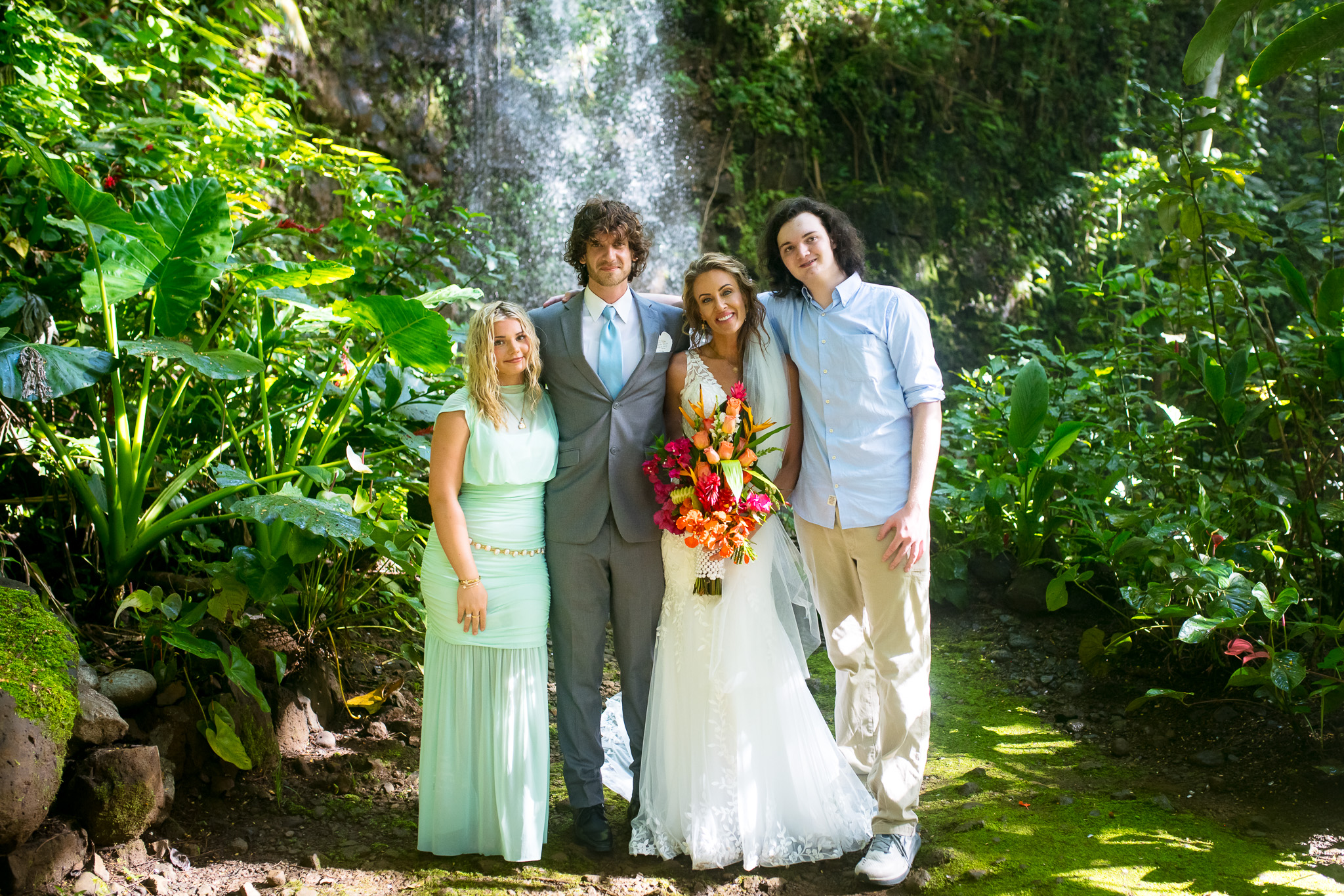 kauai elopement family portrait in front of waterfall
