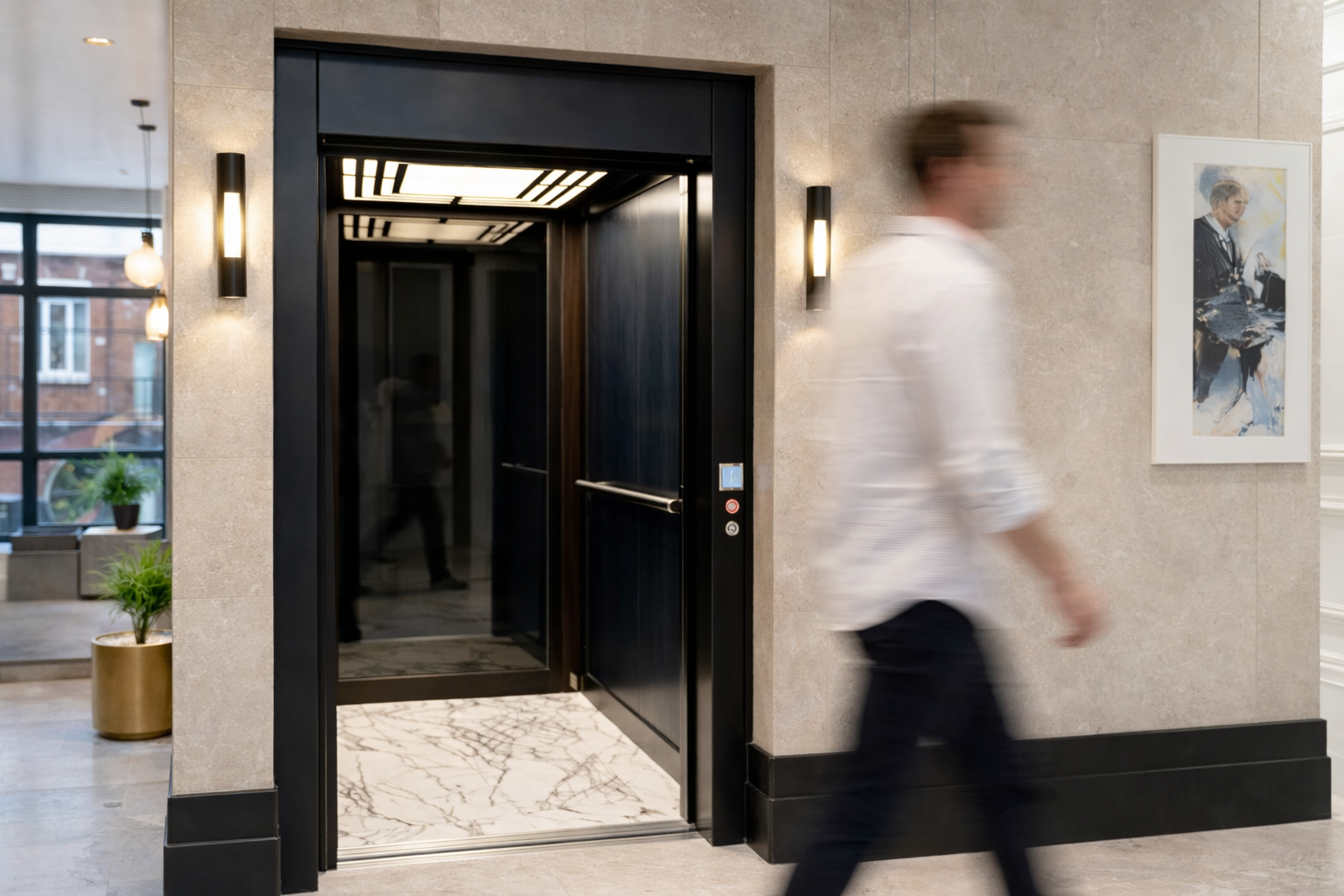 Low headroom lift with swing landing doors in a private house. The home lift incorporates a low pit within a timber clad shaft