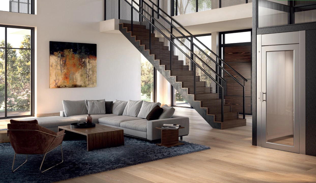 Home Lift with black painted swing landing door installed adjacent to the staircase of a contemporary home