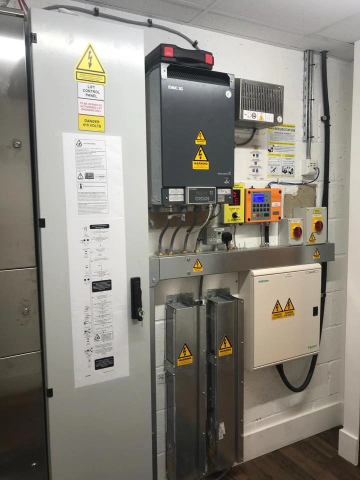 Lift engineer carrying out preventative maintenance checks