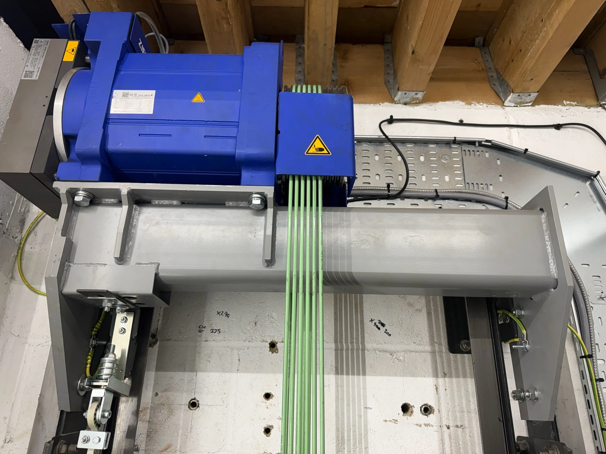 Original lift motor before replacement during the Tower Apartments lift modernisation works.