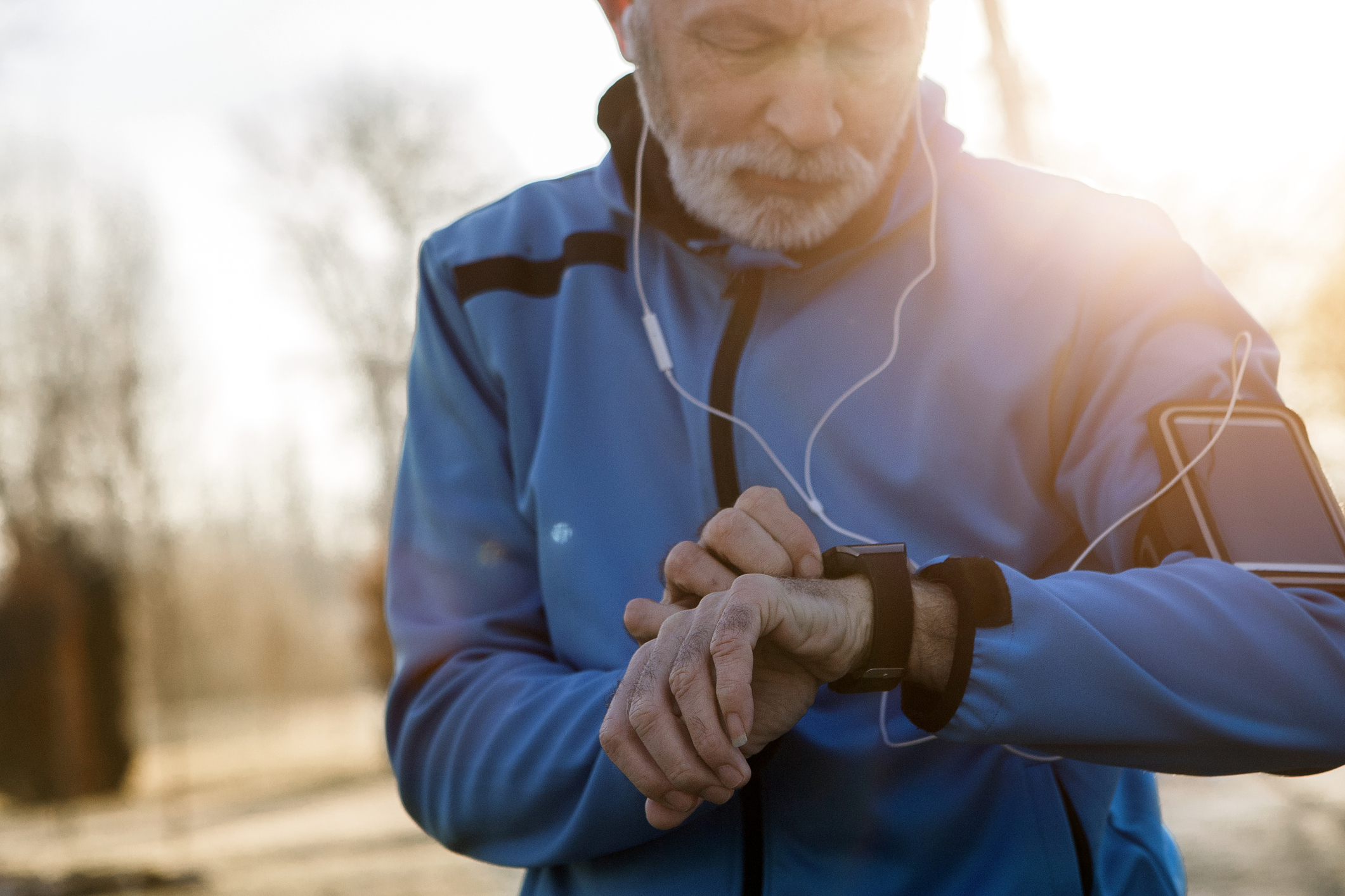 enior Man using Smart Watch measuring heart rate