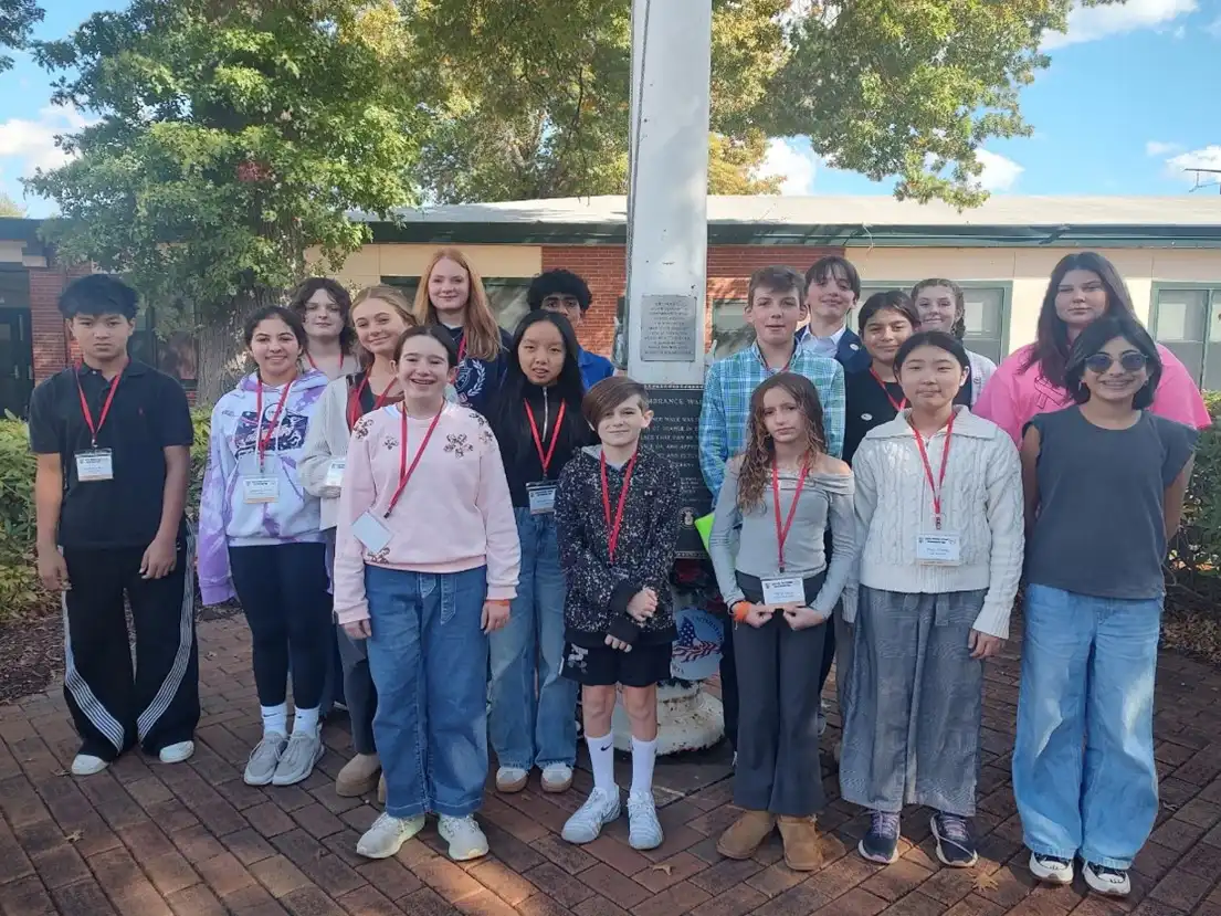 Amity Middle School students pose outside Orange Town Hall on Government Day, after shadowing local officials.