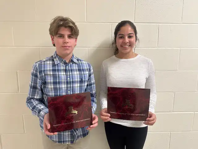 Amity Middle School eighth graders Quinn Smith and Elizabeth Scates hold their 2026 CAPSS Superintendent Awards for leadership and service.