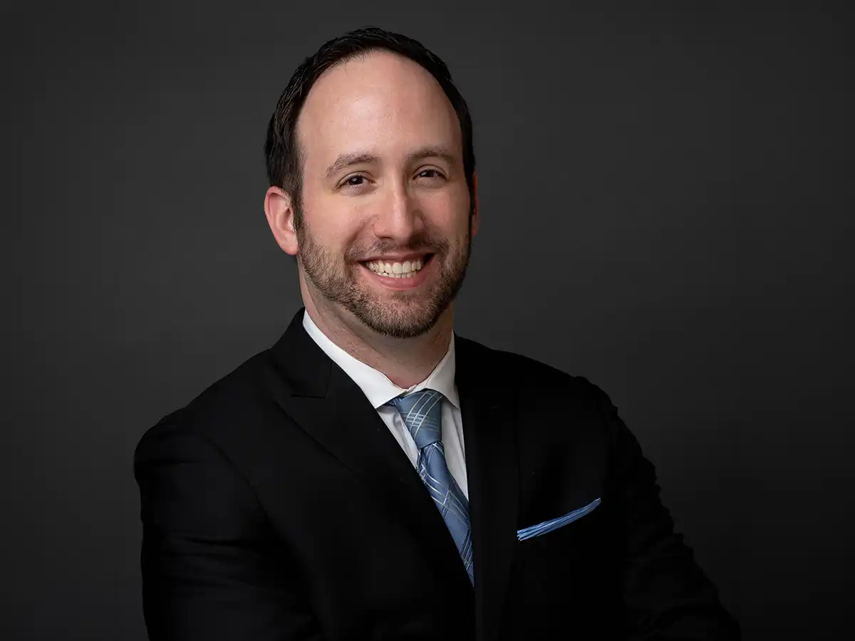 Owen T. Weaver, candidate for Connecticut’s 14th State Senate District, wearing a suit and smiling in a professional headshot for his political campaign.