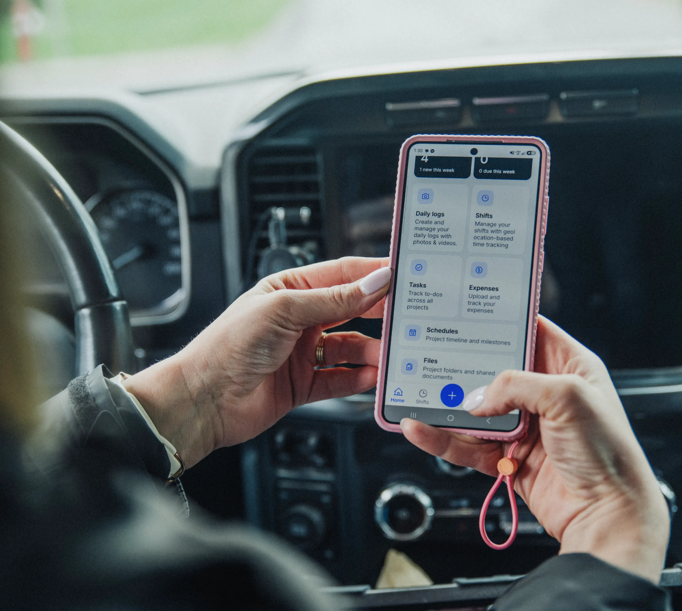 A project manager using the Billdr PRO app in a car