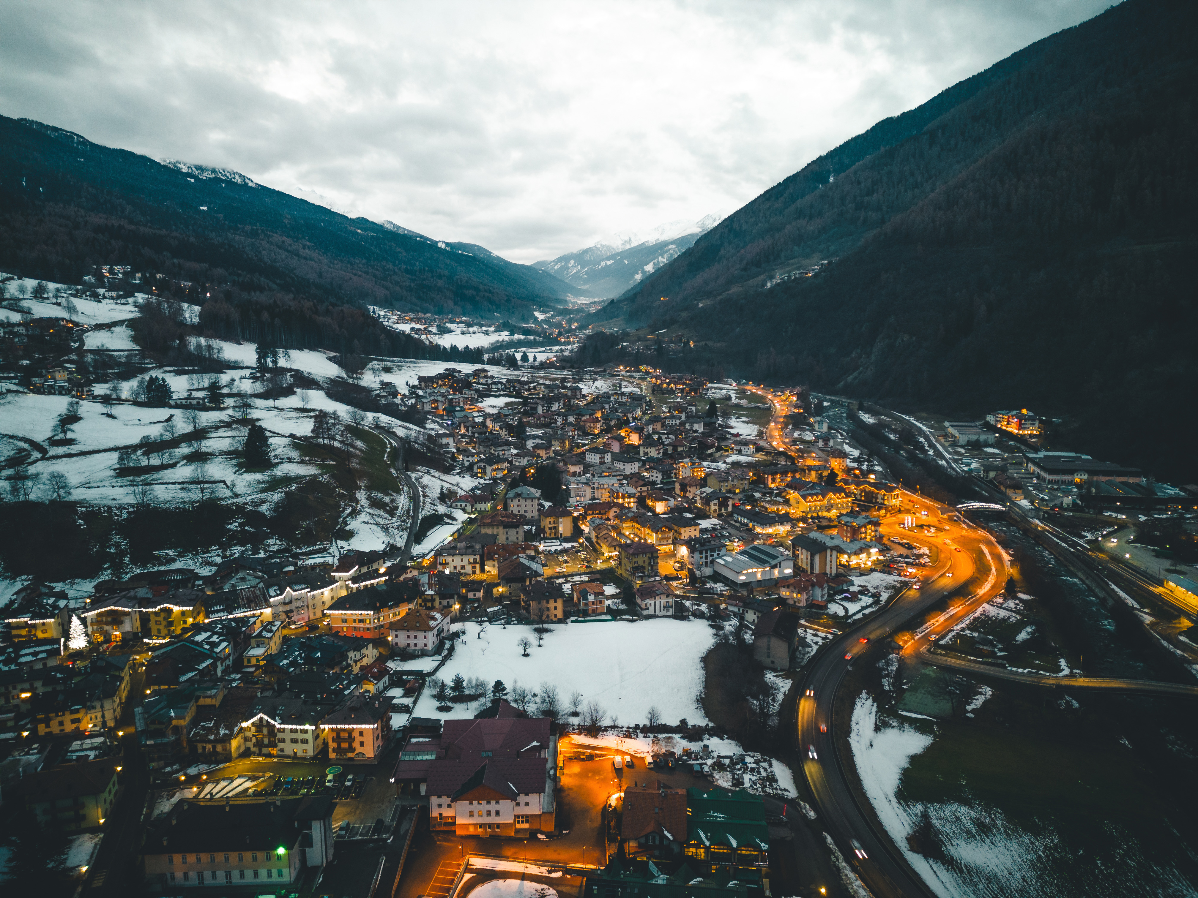 Photo of Bird's Eye view shot of a mountain village during blue hour 