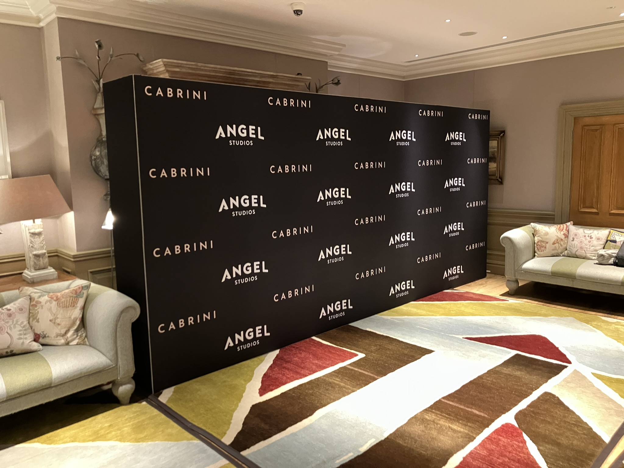 4.8 meter wide Step and Repeat Wall on hire with a client in Fitzrovia London - Product Example Photo 19